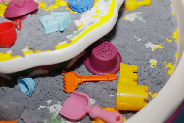 Kinetic sand and molds in the children's entertainment center. selective focus - Photo, Image