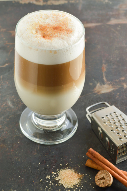 Cinnamon latte. Coffee on a dark background - Photo, Image