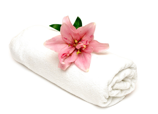 Lily and towel on a white background - Foto, Bild