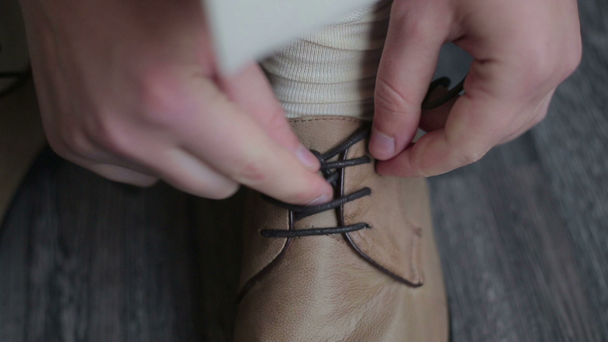 Man trying shoelaces - Footage, Video