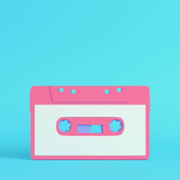 Pink vintage audio tape on bright blue background in pastel colors. Minimalism concept. 3d render - Photo, Image