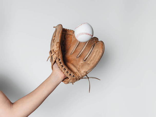 Baseball is caught in worn baseball glove. - Фото, изображение