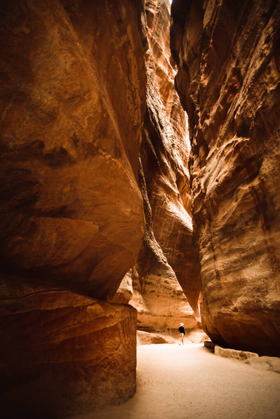 The Siq, the narrow slot-canyon that serves as the entrance passage to the hidden city of Petra, Jordan - Photo, Image