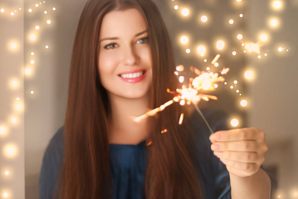 Holiday magic, Christmas and New Year celebration, happy woman with sparklers, portrait - Photo, Image