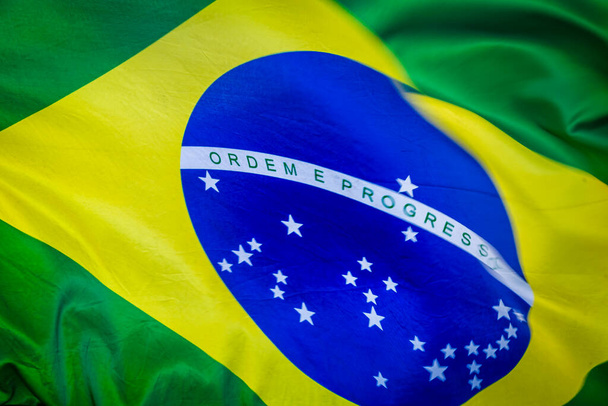 National flag of Brazil winding on blue sky in Brasilia, South America - Foto, Imagem