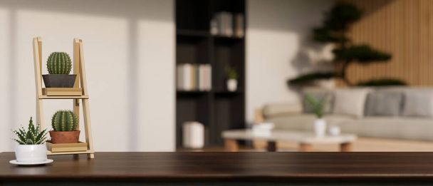 Сучасний темний дерев'яний стіл з кактусом, декором і копією простору для монтажу вашої продукції виставляється на розмитому сучасному скандинавському затишному вітальні на задньому плані. 3d render, 3d illustration - Фото, зображення