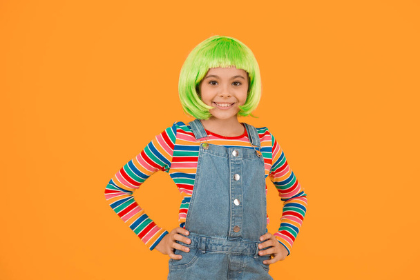 Coloring childs hair great way upgrade costume. Change color. Pigment dye hair. Growing freedom for self expression. Fantasy hair trend. Kid girl with bright vibrant hairstyle. Artificial wig concept. - Фото, зображення