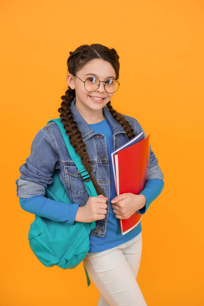 My study routine. Happy child back to school. Small girl hold books yellow background. Study and education. Home study and schooling. Private teaching. Good study habits. Where knowledge begins. - Fotografie, Obrázek