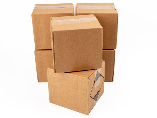 Cardboard box on a white background. Closed cardboard boxes. close-up. - Photo, Image