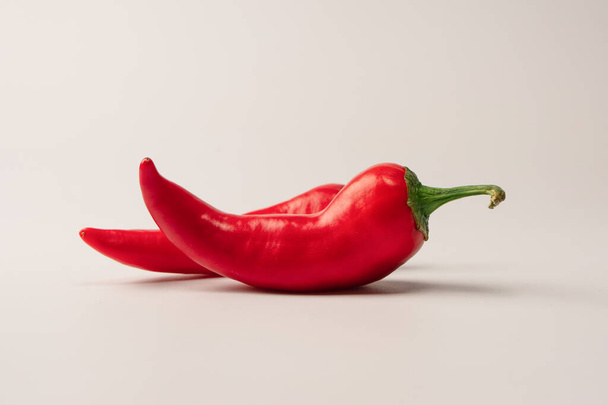 Red hot chili pepper isolated on a white background.  - 写真・画像