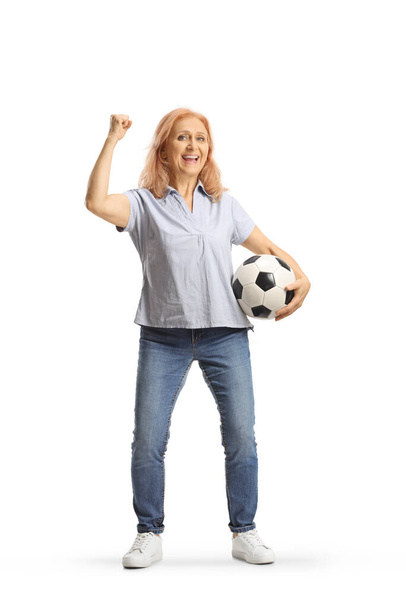 Mature woman holding a football and cheering isolated on white background - Фото, зображення