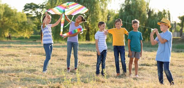 Children flying kite on summer day - Foto, imagen
