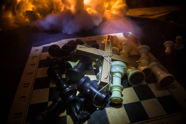 Concept of war or manipulation with global politics. Conceptual image of war using chess board and manipulation symbol. Selective focus - Foto, Bild
