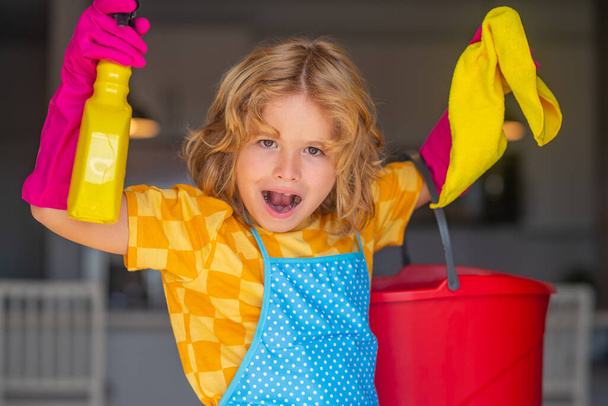 Portrait of child helping with housework, cleaning the house. Housekeeping, home chores - Photo, Image