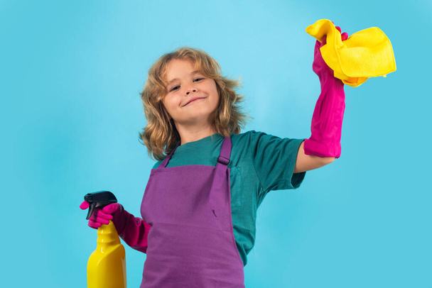 Portrait of child cleaning, concept growth, development, family relationships. Housekeeping and home cleaning concept. Child use duster and gloves for cleaning. Studio isolated background - Photo, image