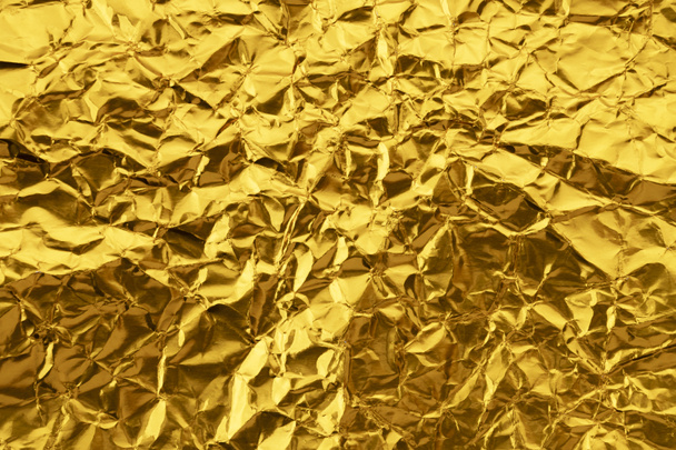 Zerknüllte Goldpapier Textur Hintergrund - Foto, Bild