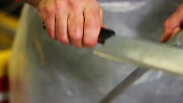 Butcher sharpens knives - Footage, Video