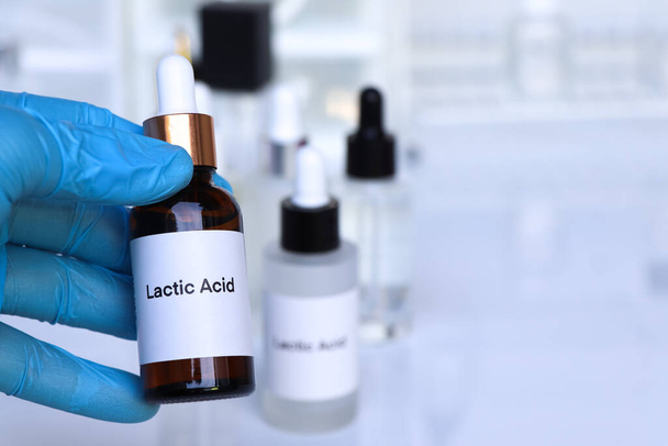 lactic acid in a bottle, chemical ingredient in beauty product, skin care products - Photo, Image