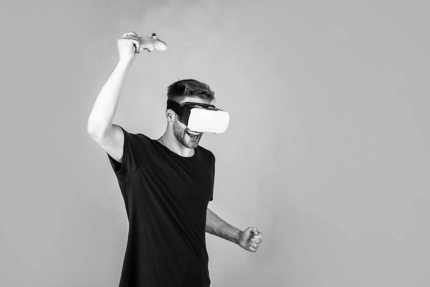 Testing new technologies. guy use modern technology. digital future. playing virtual computer video game online. young man in vr glasses. new technology and innovations. male in wireless headset. - Φωτογραφία, εικόνα