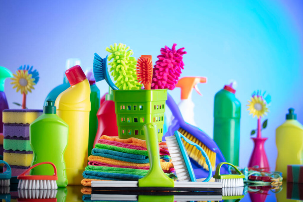 House  and office cleaning products. Colorful cleaning kit on blue background. - Photo, Image