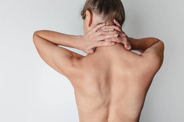 Naked female back. Female hands behind head. Rear view - Photo, Image