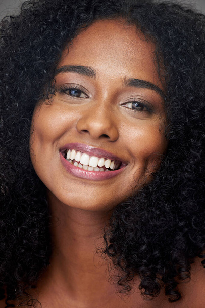 Hair care, portrait and smile of a woman with beauty, skincare and makeup. Face of a young, happy and African girl model with cosmetics, happiness with dental teeth and facial dermatology care. - Foto, immagini