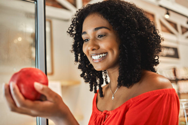 Supermarket, shopping and black woman with quality apple check, healthy food price and discount for commerce, retail and supply chain industry. Happy woman in grocery store with fruits for nutrition. - Foto, Bild