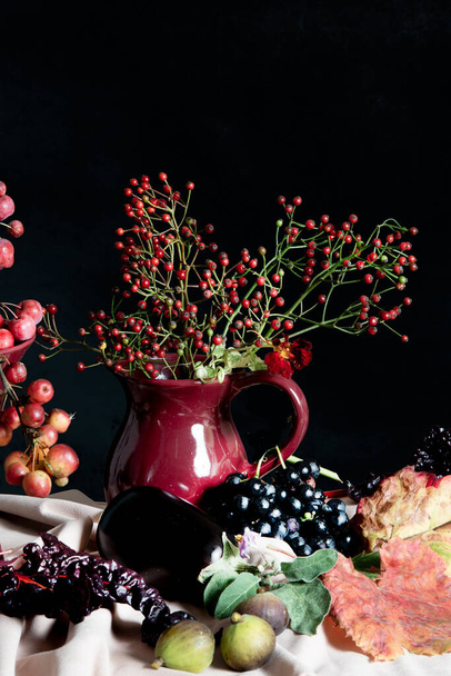 Autumn table setting with twigs of berries in vases. High quality photo - Fotoğraf, Görsel