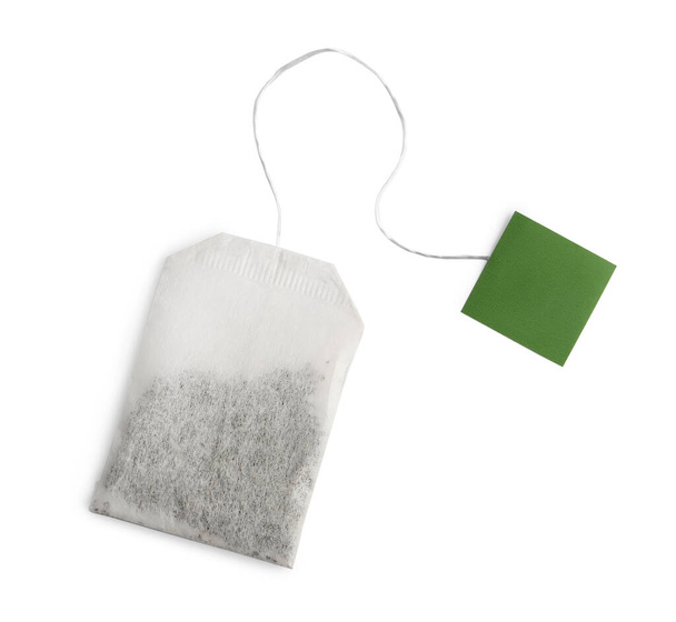 Paper tea bag with tag isolated on white, top view - Fotó, kép