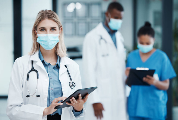 Covid hospital, woman doctor and portrait of tablet research, wellness and medical planning in clinic. Young healthcare worker, face mask and digital app consulting for online test results in surgery. - Foto, Bild