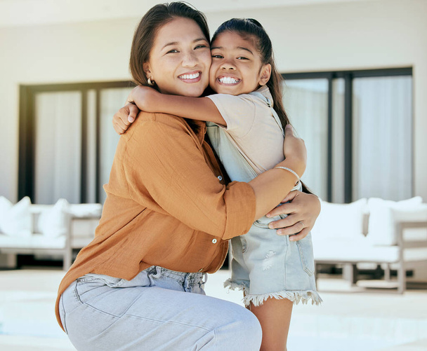 Mother with daughter hug, love and smile in family portrait, bonding together at home. Woman, girl and care, happy hugging and childhood, parent with child spending quality time outdoor - Foto, Imagen