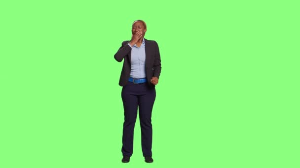 Corporate woman yawning and feeling tired at work, standing on green screen backdrop. Exhausted employee falling asleep and acting fatigued over full body greenscren, sleepy adult. - Footage, Video