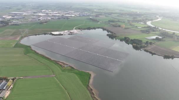 Largest floating solar park in Europe on a sand extraction lake, Bomhofsplas in Zwolle, The Netherlands. Sustainable renewable energy extraction. - Footage, Video