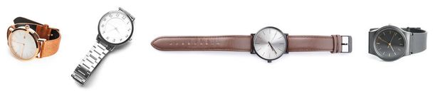 Набор стильных мужских наручных часов на белом фоне - Фото, изображение