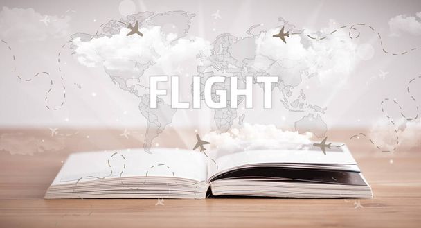 Άνοιγμα βιβλίου με επιγραφή FLIGHT, έννοια διακοπών - Φωτογραφία, εικόνα