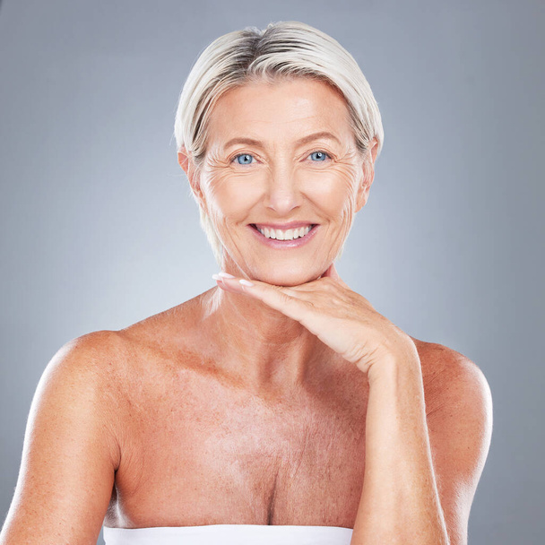 Senior woman, smile and skincare face, makeup and happy with beauty, smile and cosmetics in studio portrait. Elderly model, happiness or skin cosmetic, shine or glow for healthy, facial or wellness. - Photo, Image