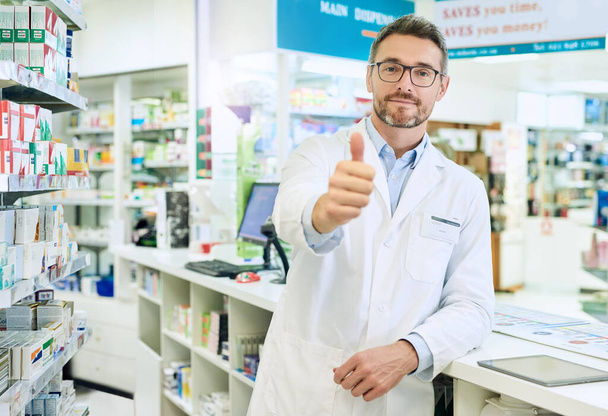 Ill make you feel better in no time. Portrait of a confident mature pharmacist working in a pharmacy - Foto, imagen