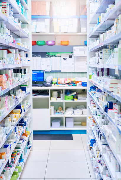 We have just the medicine for you. shelves stocked with various medicinal products in a pharmacy - Photo, Image