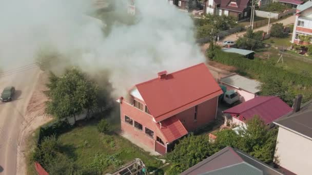Private red house in smoke. Emergency. Residential area. Emergency. Fire. Aerial drone footage. Top view. High quality 4k footage - Footage, Video