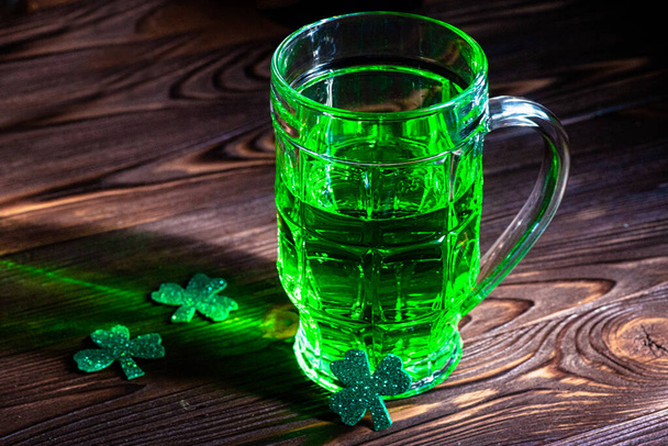 Traditional green beer, St. Patrick's Day. Brewed Irish beer in a bubble for the holiday. - Photo, Image