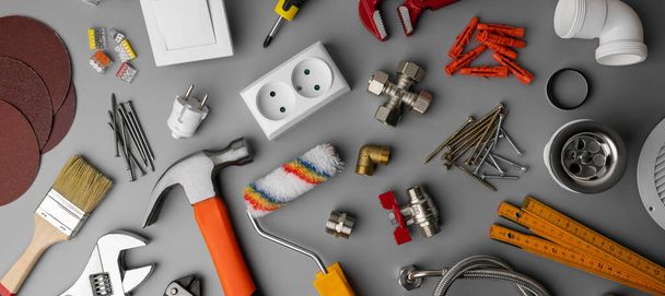 household hardware store tools and items on gray background. home repair. banner - Zdjęcie, obraz