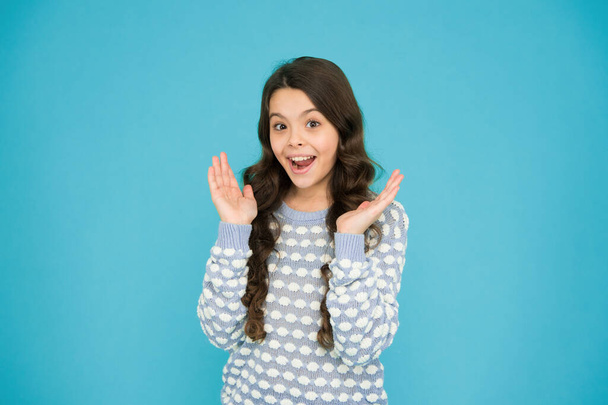 Smiling small girl with long hair. Beauty and health. It s her happy time. Childhood concept. International childrens day. Child care. Happy childhood. Emotional girl. Little girl blue background. - 写真・画像