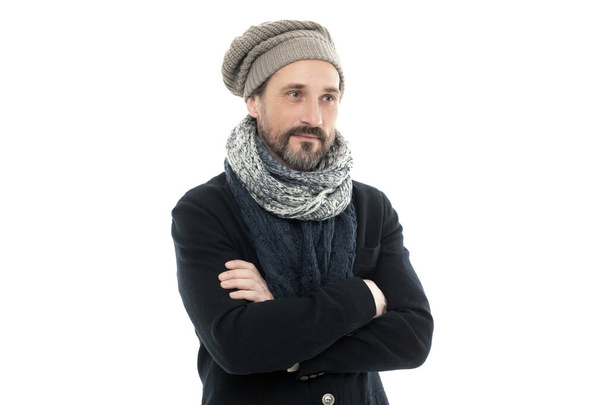 man smile and wear winter warm clothes isolated on white background. studio shot of man wearing warm clothes and hat. man winter fashion with warm clothes. mature man in winter warm clothes. - Фото, изображение