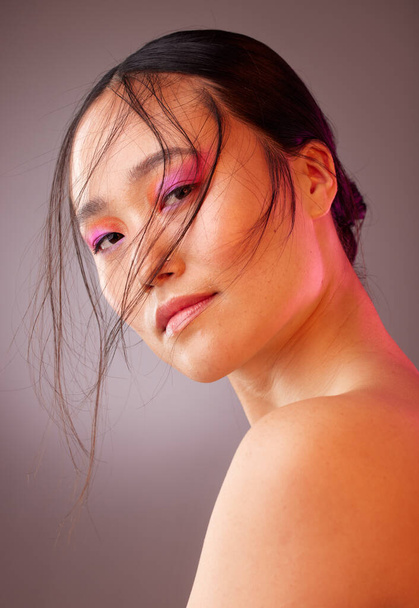 Skincare, beauty and pink makeup, portrait of woman from Japan, neon eyeshadow on face. Health, luxury and edgy fashion, creative skin care product treatment and healthy cosmetic glow on asian girl - Photo, Image