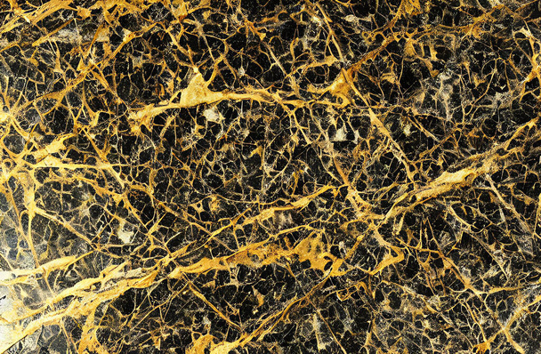 Golden marble texture with many contrasting textures. The abstract gold marble can also be used to create surface effects on architectural floors; ceramic floors and wall tiles. - Photo, Image