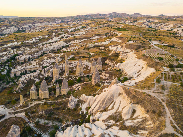 Magic fungous forms of sandstone, Love Valley between Avanos and Goreme road in Cappadocia, the Central Anatolia Region of Turkey. High quality photo - Φωτογραφία, εικόνα