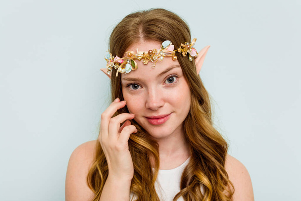 Young elf woman isolated on blue background - Foto, Imagen