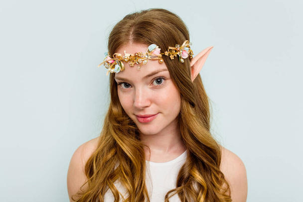 Young elf woman isolated on blue background - Foto, Bild