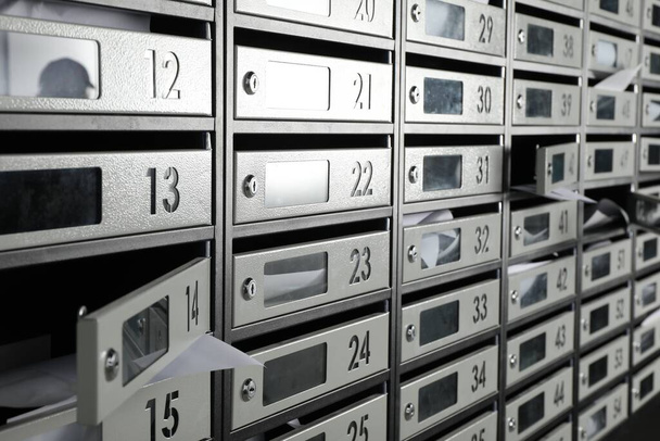 New mailboxes with keyholes, numbers and receipts - Фото, изображение