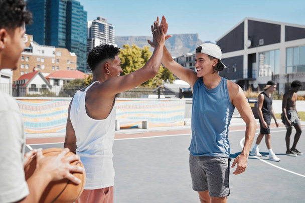 Basketball, high five and sports team hands in celebration of game win, match or training. Teamwork, sport and fitness by basketball player hand in support of motivation, success and goal at court. - Photo, Image